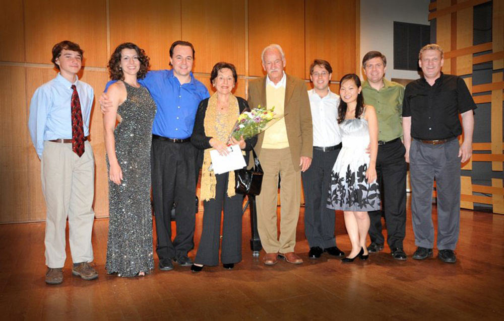 Ernst and Cidinha Mahle posing with musicians after a concert of Mahle's music in Rock Hall, Philadelphia